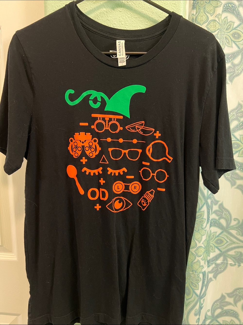 Bella Canvas Black Kids Tee with Green Hat & Orange Eye Chart Icons